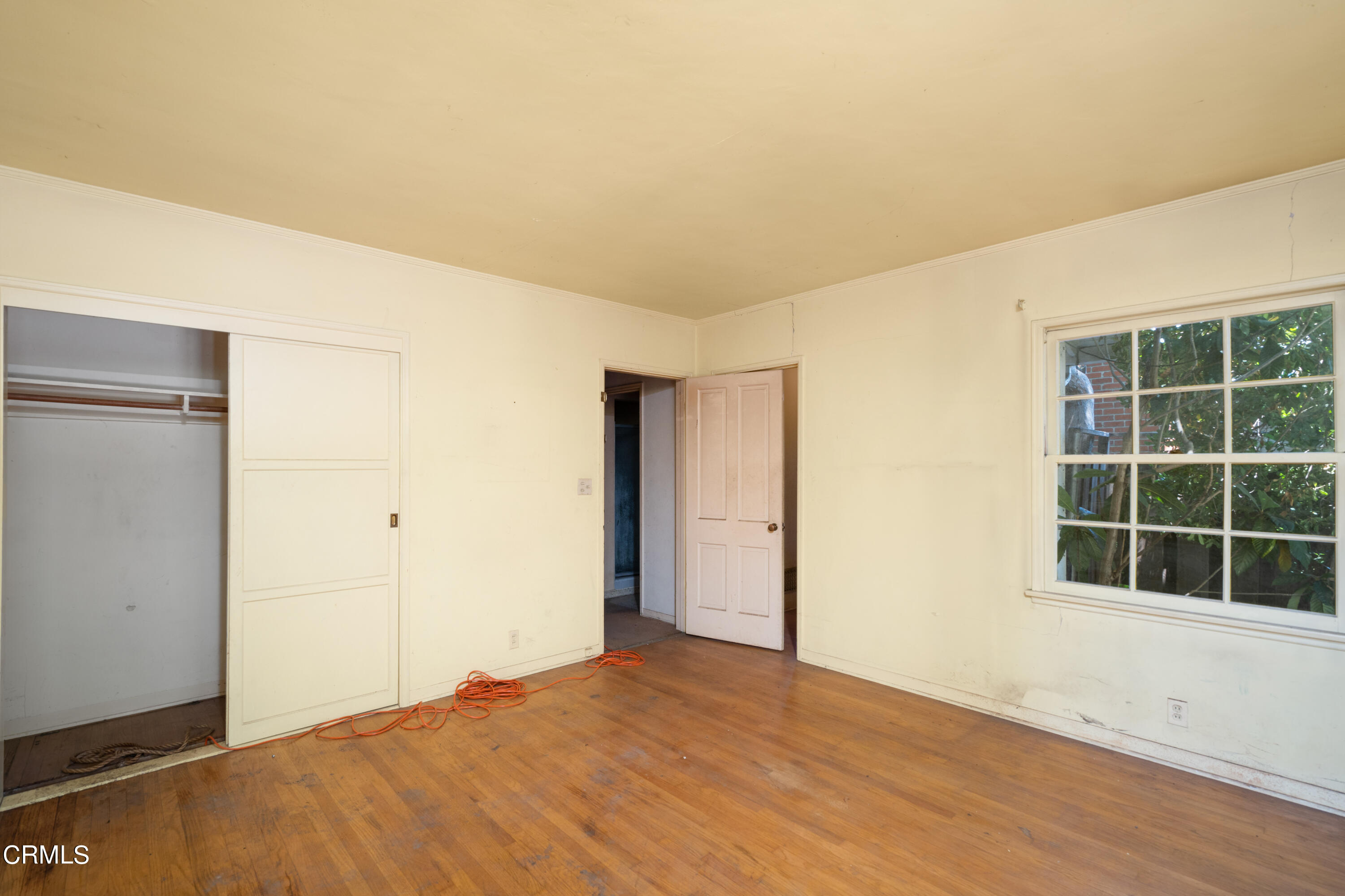 3254 Orlando Road Pasadena, CA 91107 - Photo 22 of 25 a view of empty room with wooden floor and windows