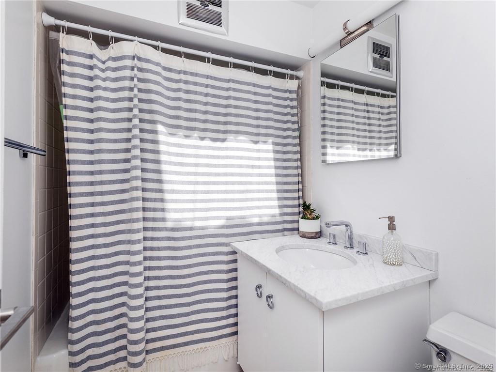 95 Shinar Mountain Road Washington, CT 06794 - Photo 14 of 27 a bathroom with a sink and a mirror