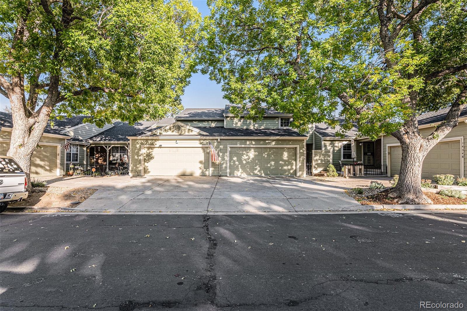 14358 East Baltic Circle Aurora, CO 80014 - Photo 1 of 20 a view of road with large trees