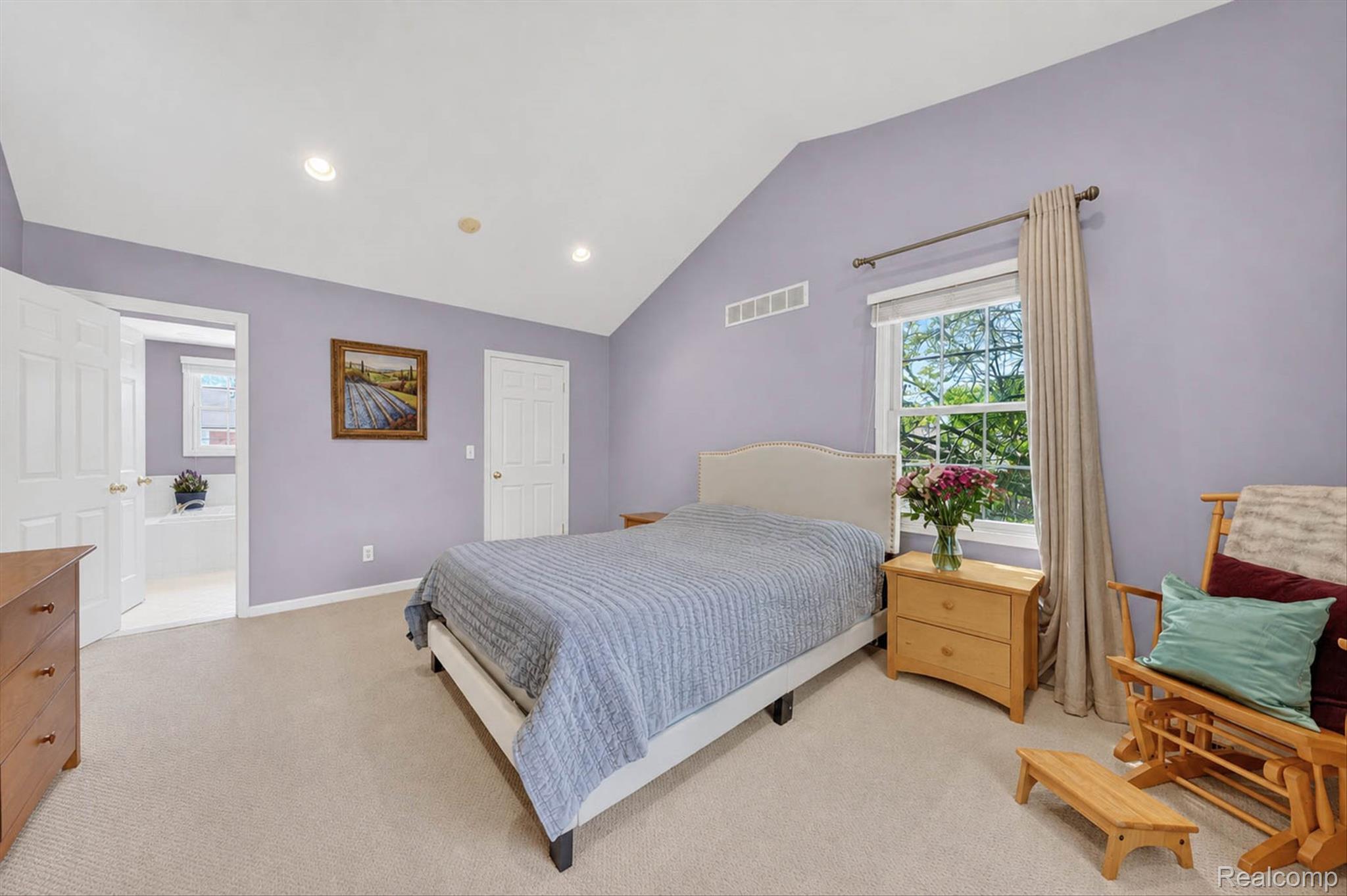 1112 Vernier Road Grosse Pointe, MI 48236 - Photo 31 of 39 Bedroom featuring vaulted ceiling, light carpet, multiple windows, and recessed lighting