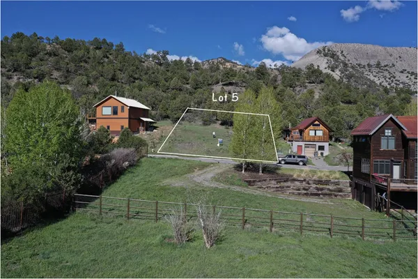an aerial view of houses with outdoor space