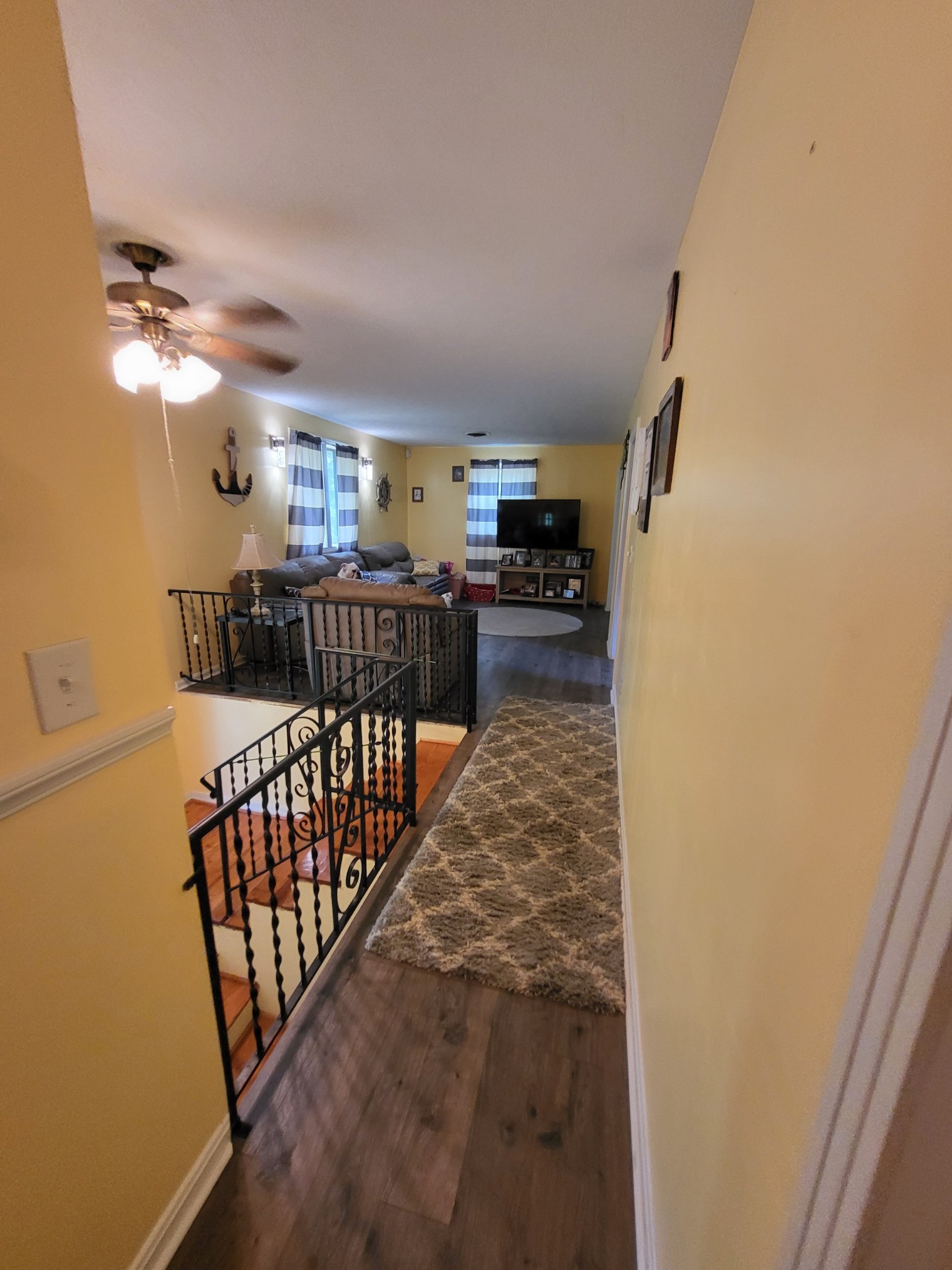 1393 Pomona Road Dickson, TN 37055 - Photo 12 of 32 a view of a hallway to a livingroom with furniture