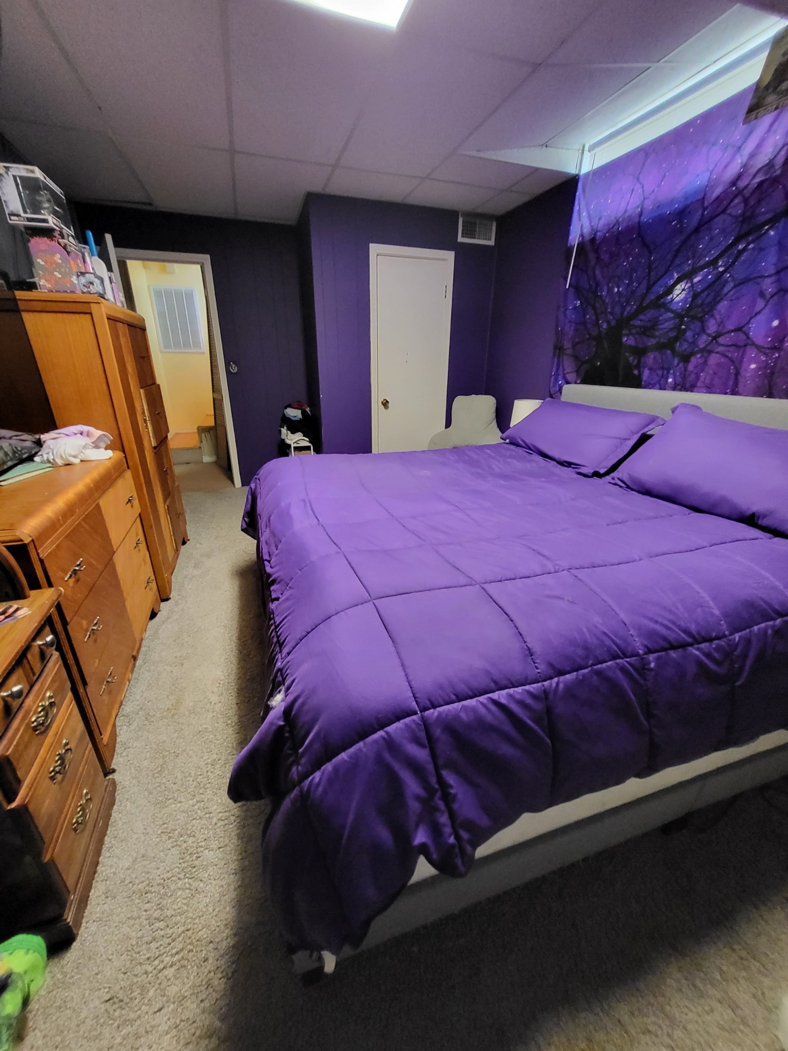 1393 Pomona Road Dickson, TN 37055 - Photo 17 of 32 a bed sitting in a bedroom next to a lamp