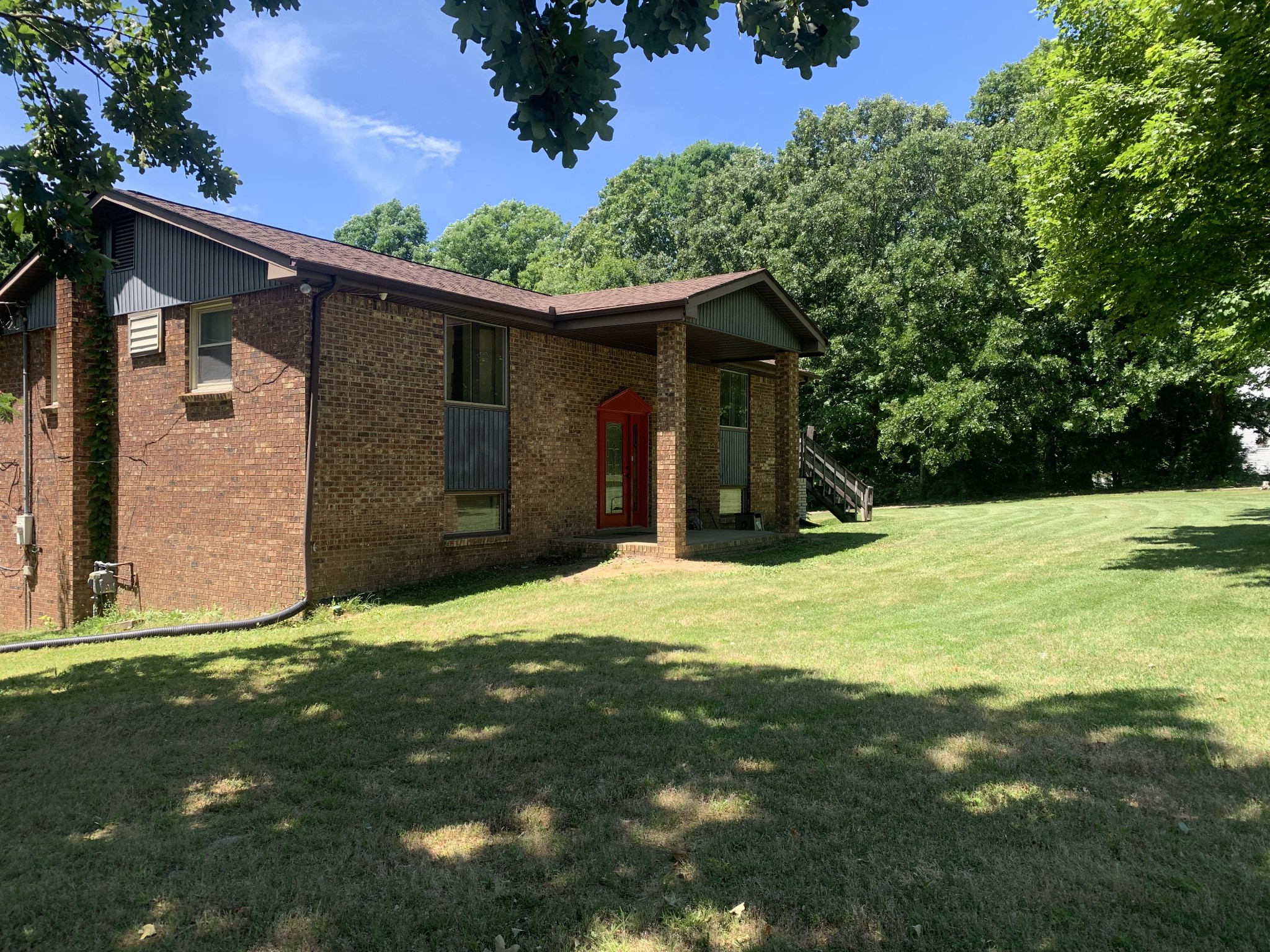 1393 Pomona Road Dickson, TN 37055 - Photo 2 of 32 a view of a backyard of the house