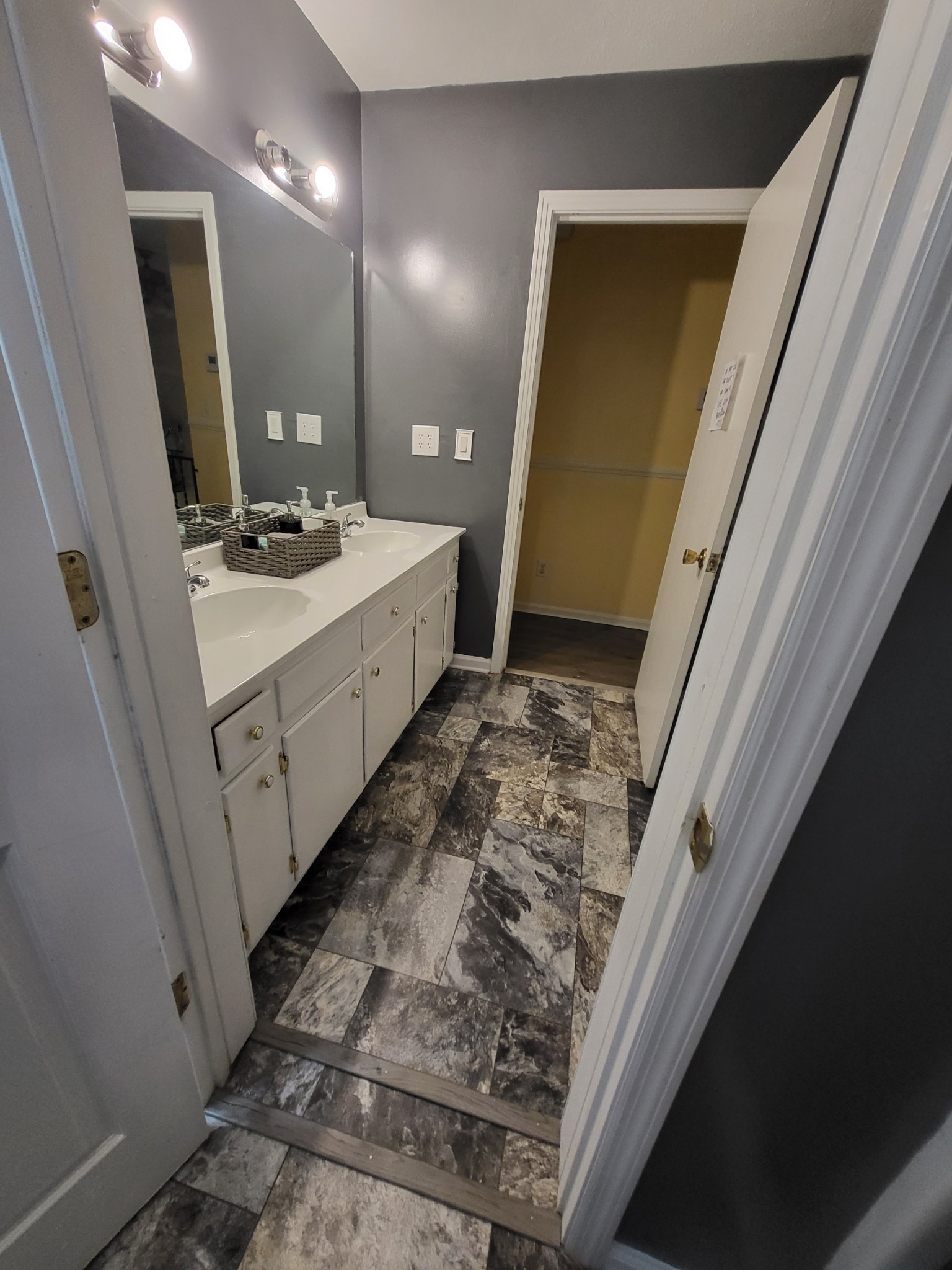 1393 Pomona Road Dickson, TN 37055 - Photo 27 of 32 a bathroom with a sink a vanity and a mirror