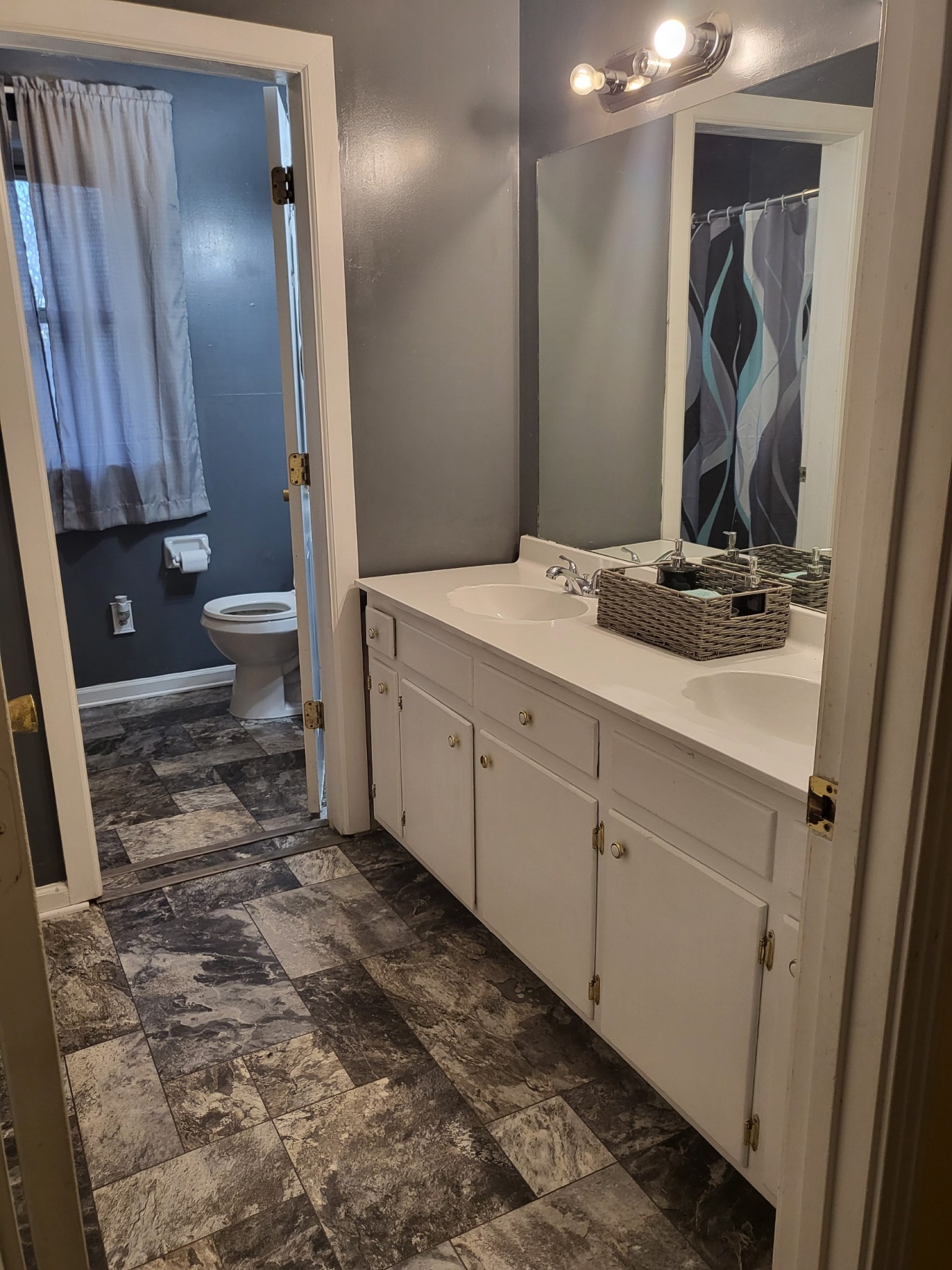 1393 Pomona Road Dickson, TN 37055 - Photo 28 of 32 a bathroom with a sink and a mirror