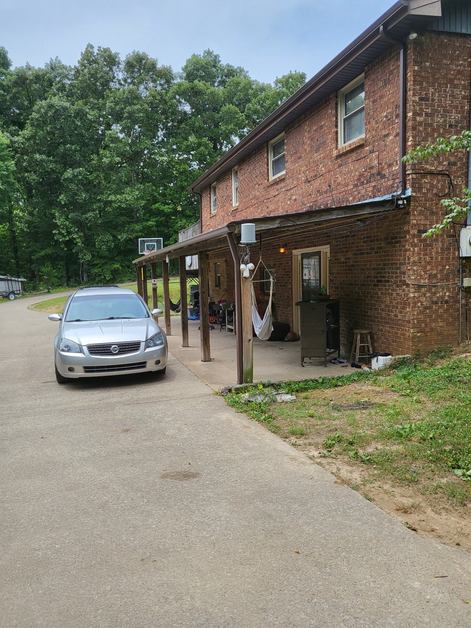 1393 Pomona Road Dickson, TN 37055 - Photo 4 of 32 a car parked in front of a brick house
