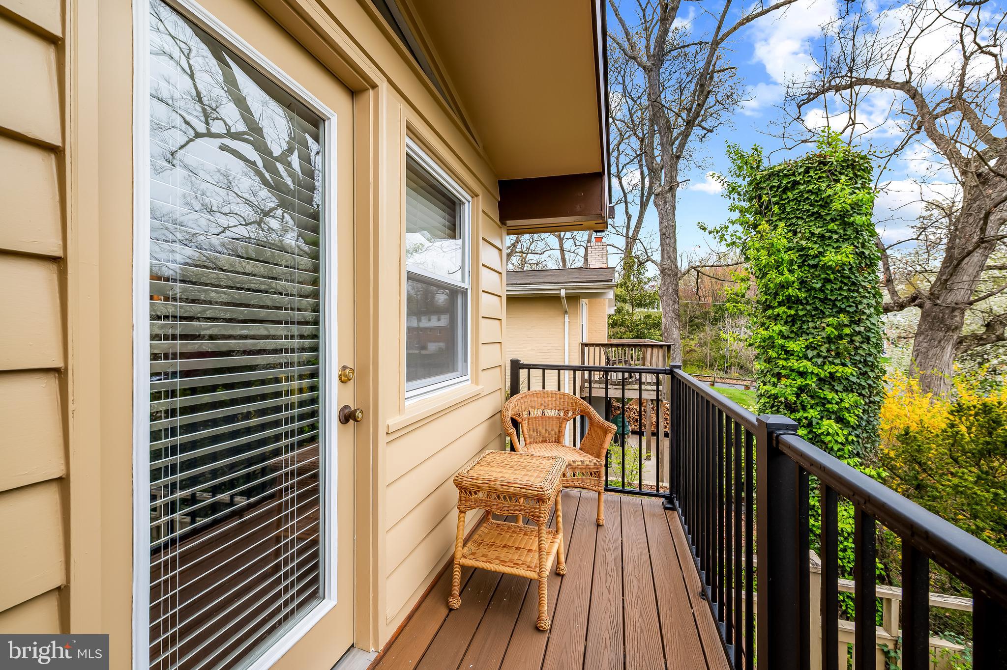 805 Litchfield Road Baltimore, MD 21239 - Photo 25 of 36 a view of a balcony with wooden floor and fence and a pot
