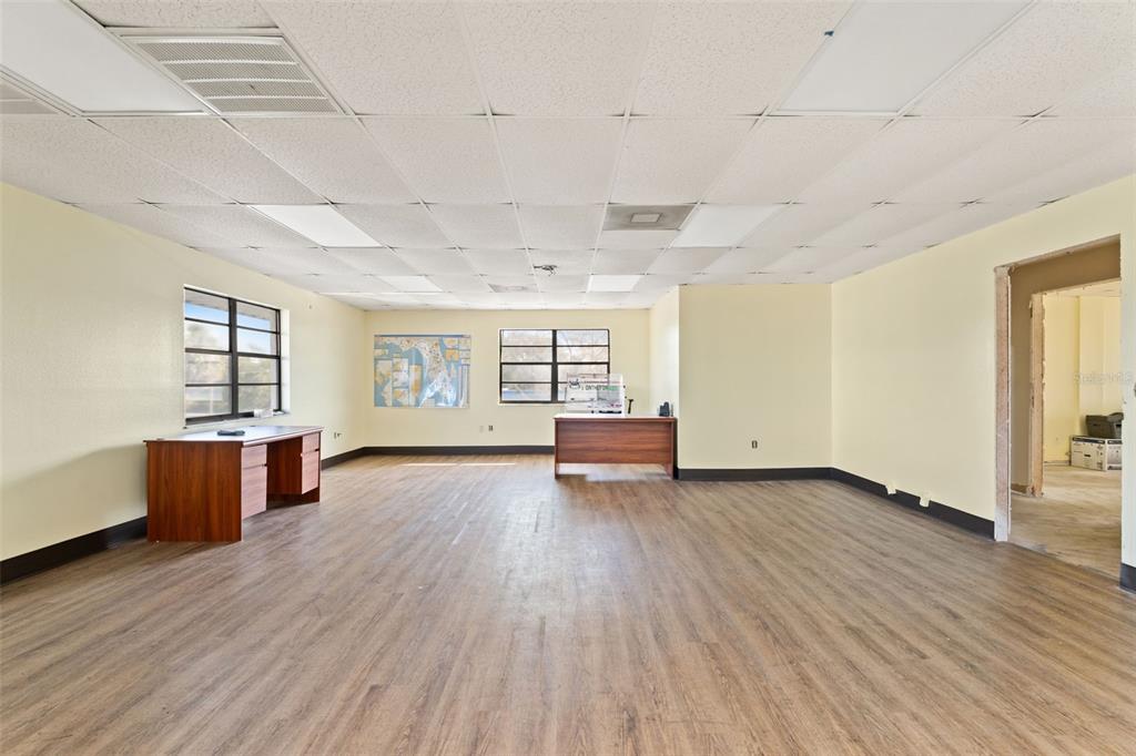 1108 Commercial Way Spring Hill, FL 34606 - Photo 6 of 17 a view of empty room with wooden floor and fan