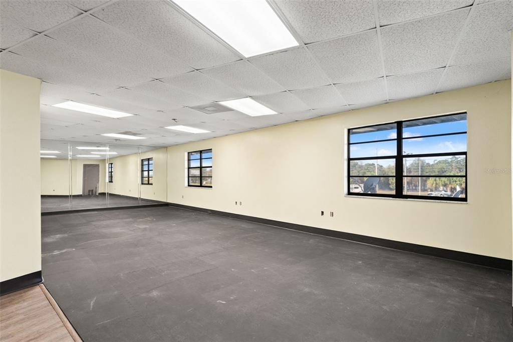 1108 Commercial Way Spring Hill, FL 34606 - Photo 7 of 17 an empty room with windows