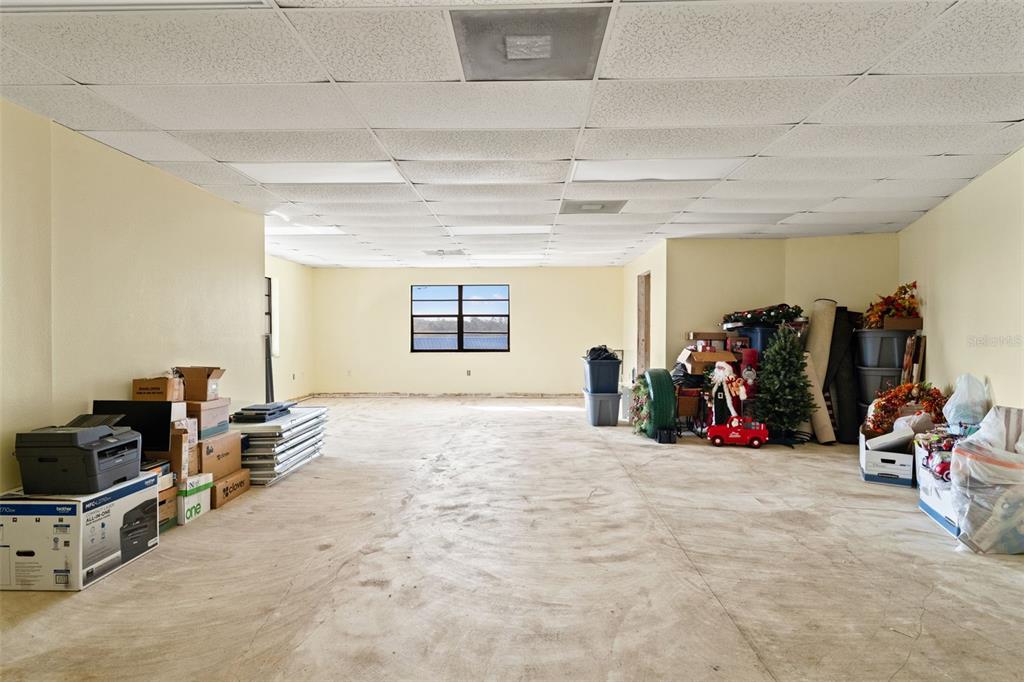 1108 Commercial Way Spring Hill, FL 34606 - Photo 9 of 17 a view of a room with gym equipment