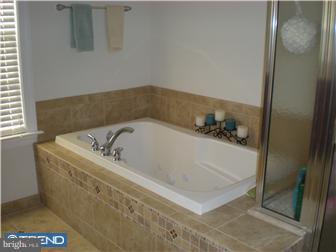 210 Middletown Road Media, PA 19063 - Photo 8 of 11 a white bath tub sitting in a bathroom
