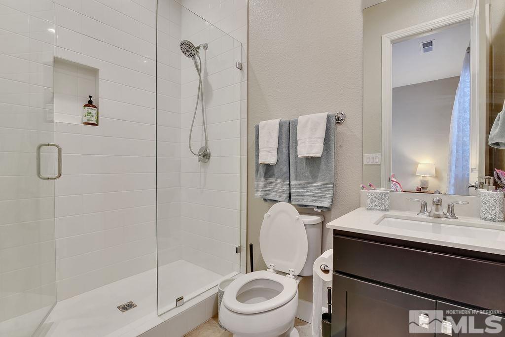 2463 Sparstone Drive Reno, NV 89521 - Photo 18 of 40 a bathroom with a sink toilet and shower