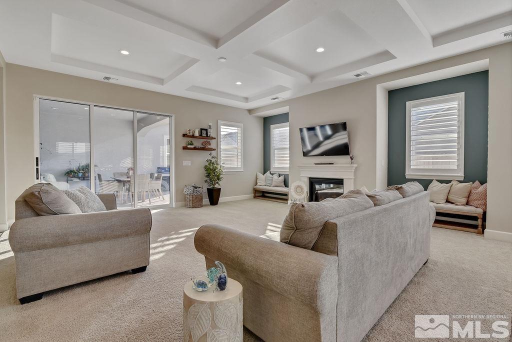 2463 Sparstone Drive Reno, NV 89521 - Photo 8 of 40 a living room with furniture and a fireplace