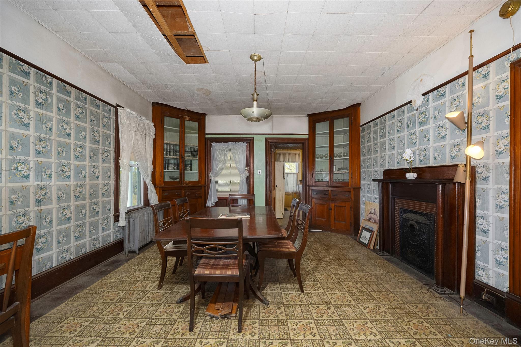 3 Spring Street Chelsea, NY 12590 - Photo 13 of 39 a dining room with furniture a chandelier and fireplace