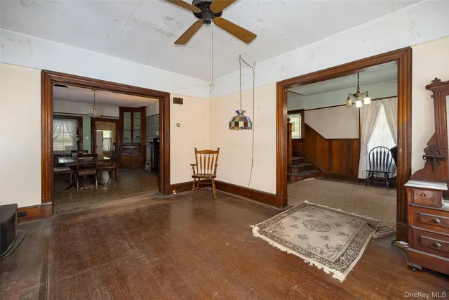 a view of a livingroom with furniture and a ceiling fan