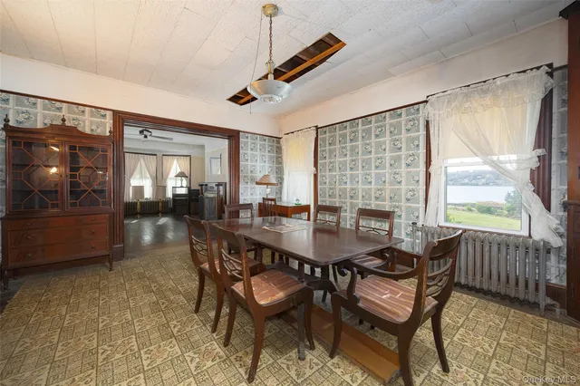 a dining room with furniture and window