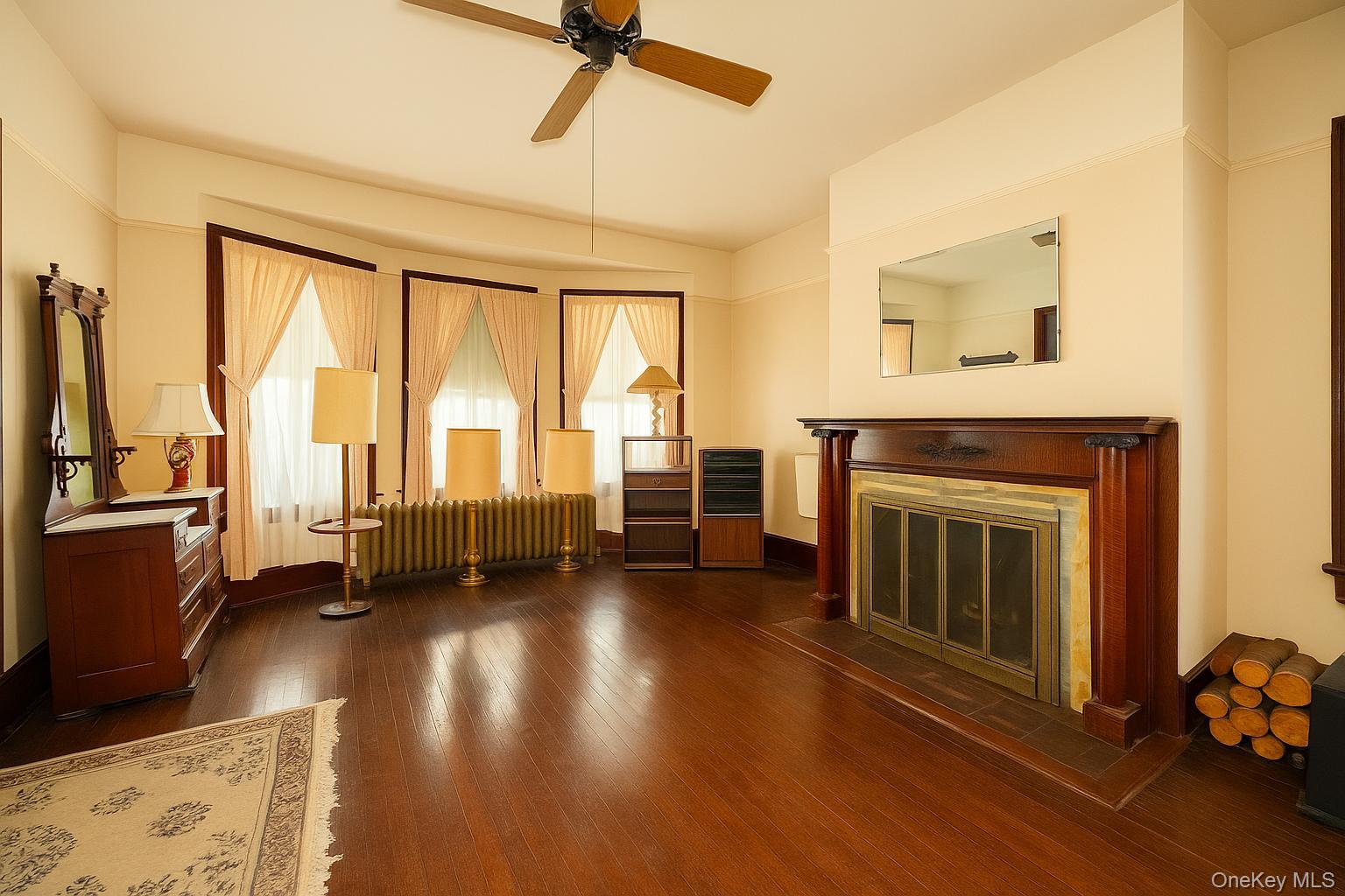 3 Spring Street Chelsea, NY 12590 - Photo 16 of 39 a view of a livingroom with furniture a fireplace and wooden floor