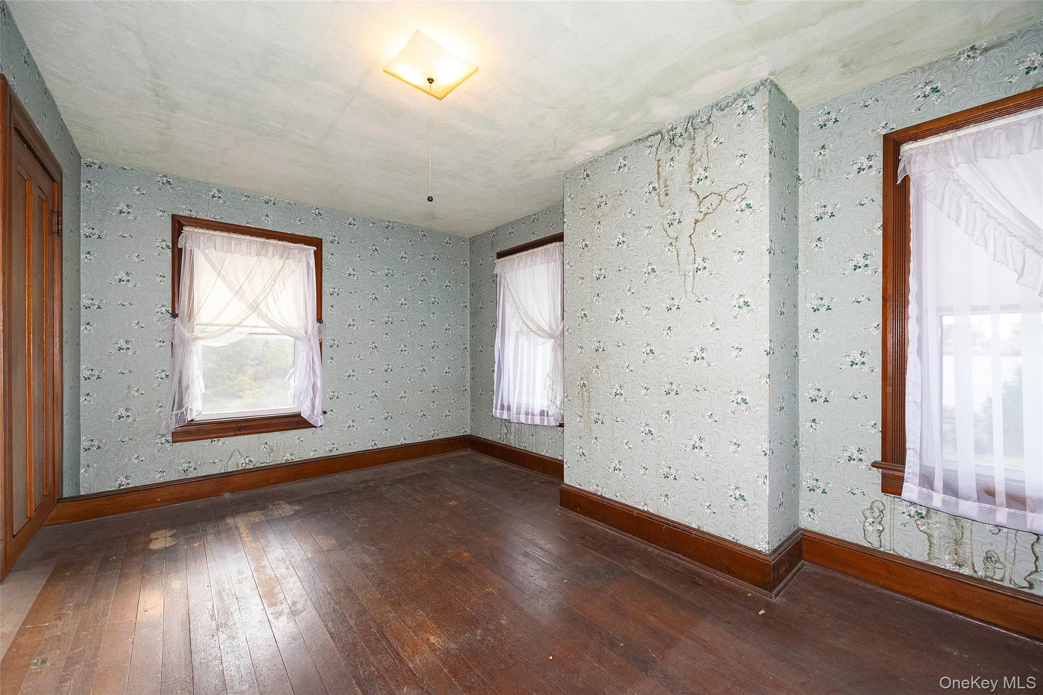 3 Spring Street Chelsea, NY 12590 - Photo 23 of 39 an empty room with wooden floor and windows