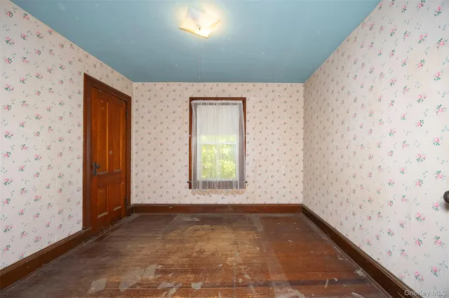 a bathroom with a granite countertop bathtub sink vanity mirror and toilet