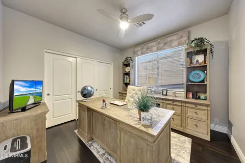 a view of walk in closet with clothes