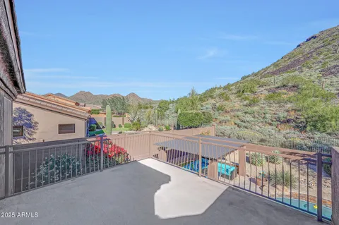 an aerial view of a house with a yard and garden