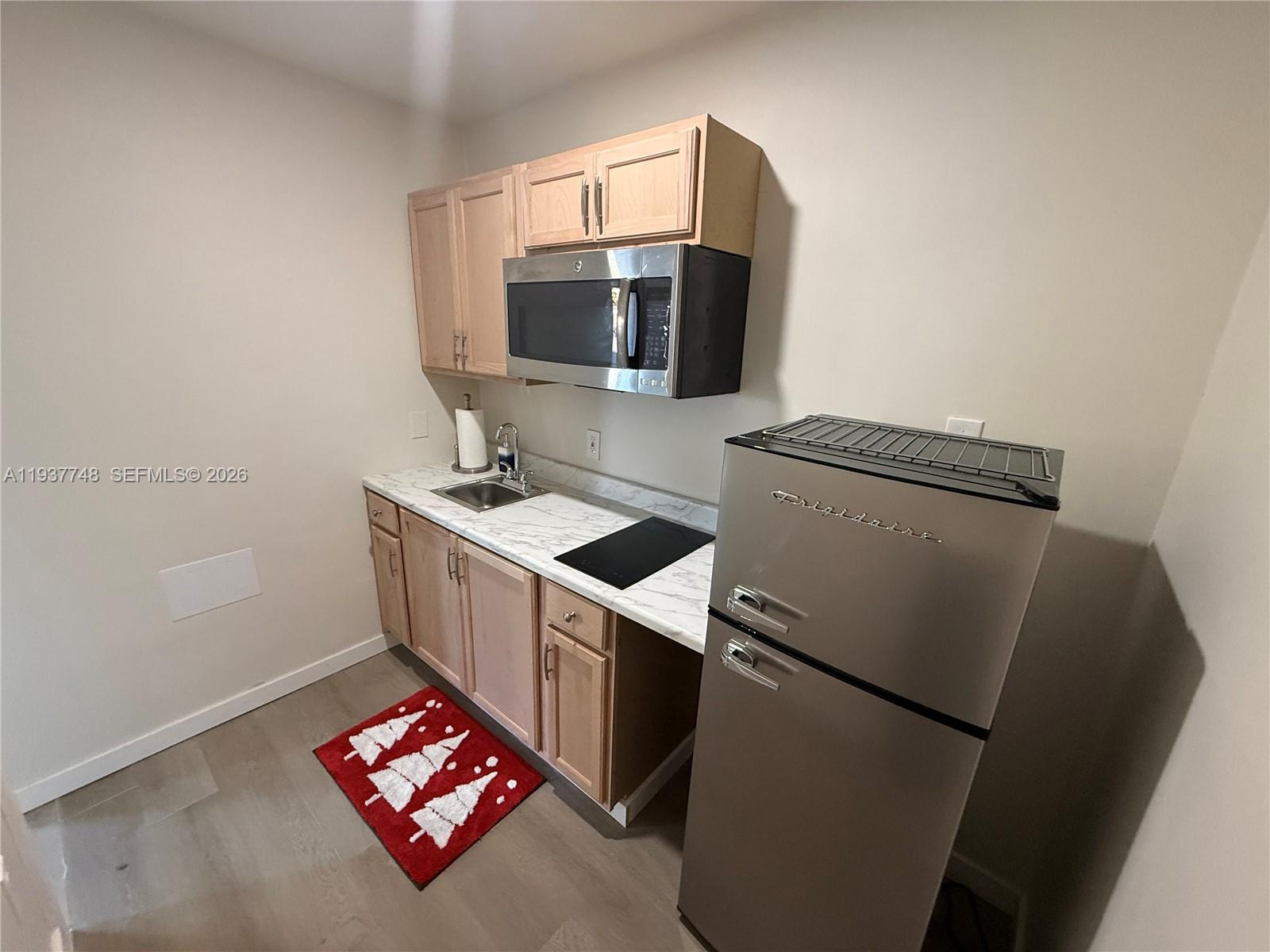10785 Southwest 26th Street, Unit A Miami, FL 33175 - Photo 9 of 9 a utility room with washer and dryer