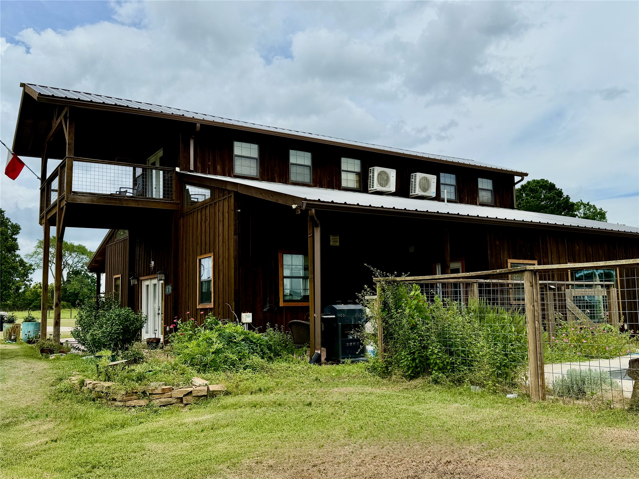 26534 Mitchell Road Hempstead, TX 77445 - Photo 2 of 11 Upstairs balcony offers breathtaking views of the property.