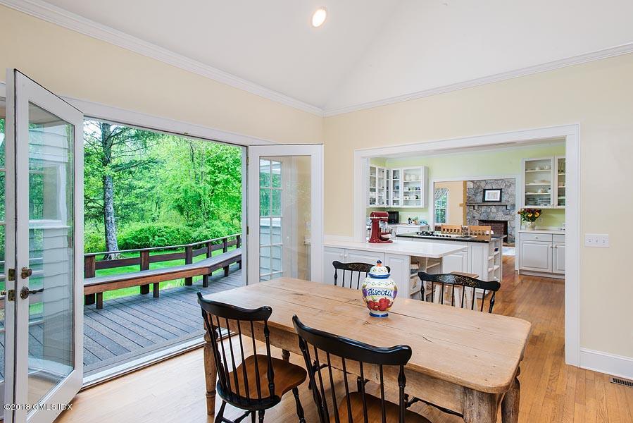 596 Riversville Road Greenwich, CT 06831 - Photo 14 of 24 a dining room with furniture and wooden floor