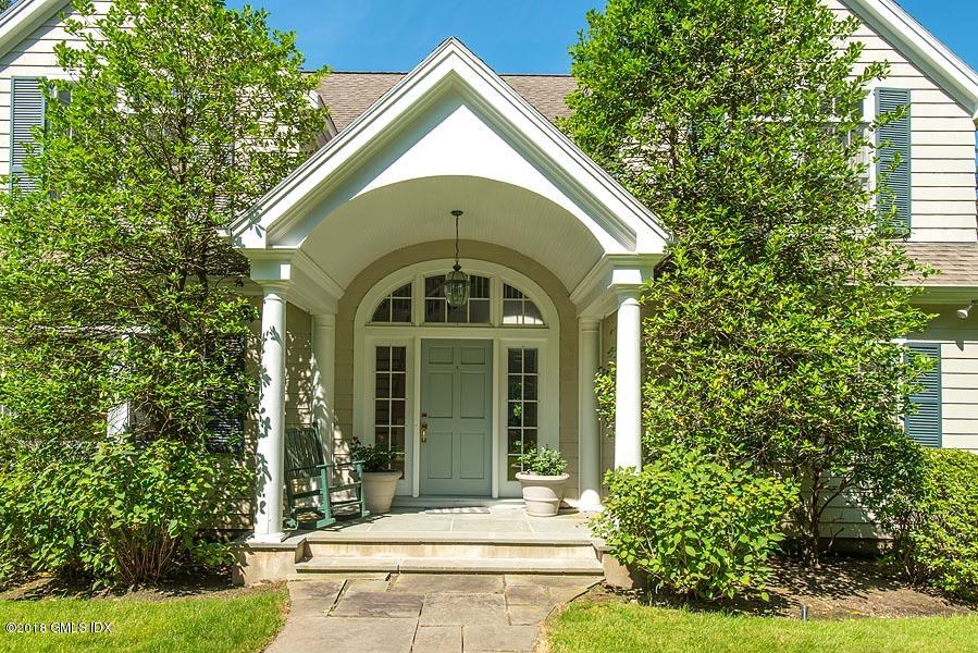 596 Riversville Road Greenwich, CT 06831 - Photo 3 of 24 a front view of a house with garden