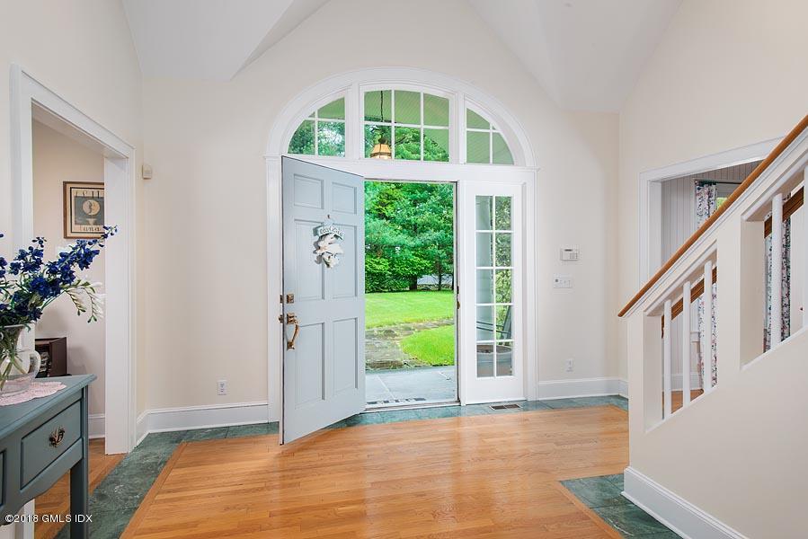 596 Riversville Road Greenwich, CT 06831 - Photo 8 of 24 a view of an entryway with wooden floor and door