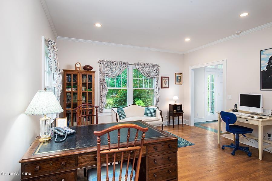 596 Riversville Road Greenwich, CT 06831 - Photo 9 of 24 a living room with furniture a wooden floor and a large window