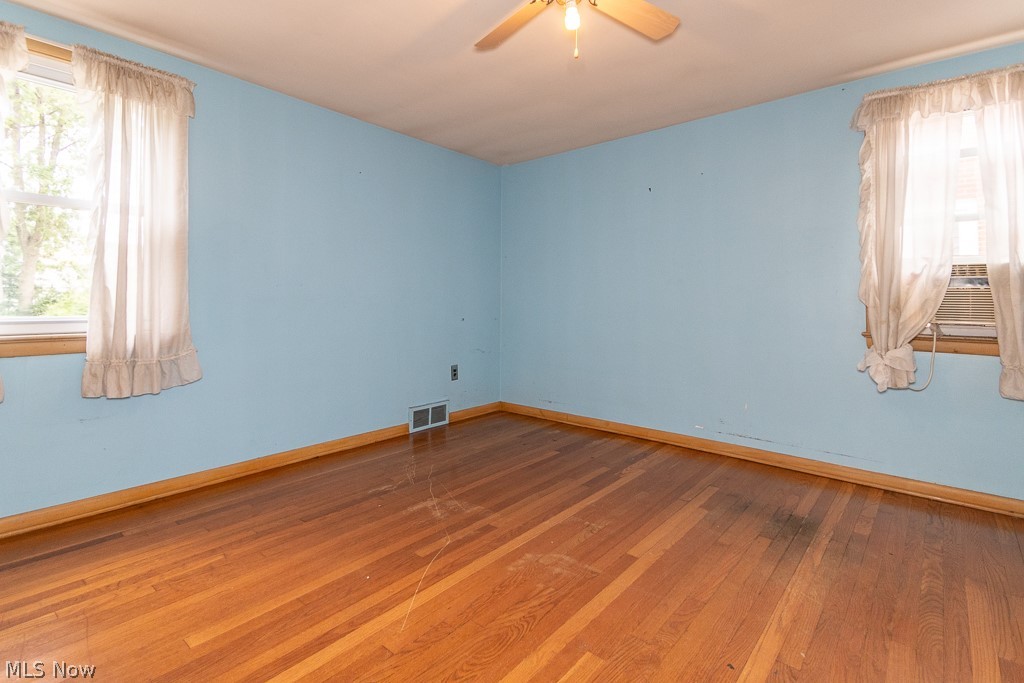 4517 Mackall Road Cleveland, OH 44121 - Photo 34 of 41 Unfurnished room with ceiling fan and hardwood / wood-style floors