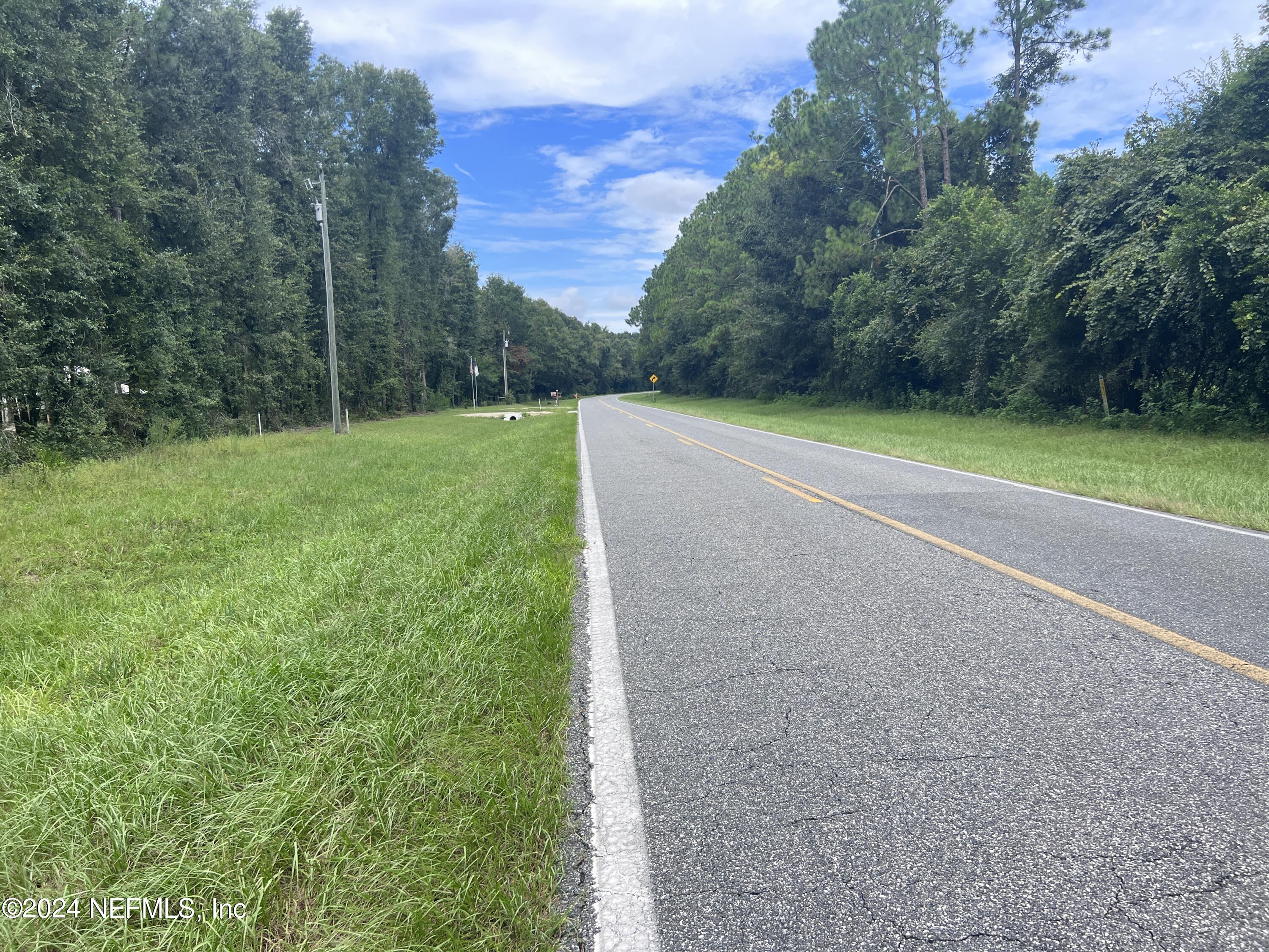 0 County Road North O'Brien, FL 32071 - Photo 6 of 10 a view of a field with trees in the background