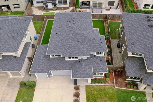 an aerial view of a house with a backyard space