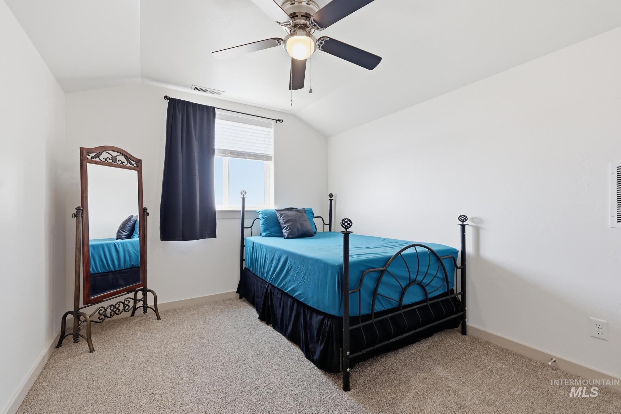 178 Syringa Loop Shoshone, ID 83352 - Photo 25 of 35 (Upstairs) Bright bedroom featuring a ceiling fan