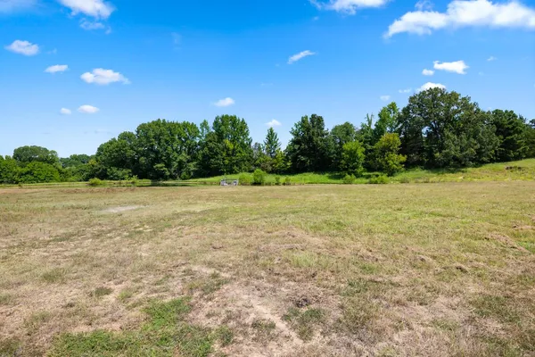 a view of a field with an outdoor space