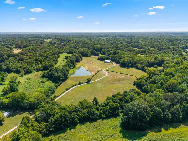 a view of a lake with a yard