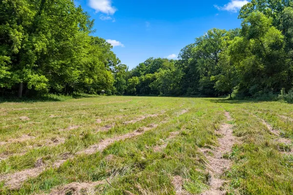 a view of pool with a yard