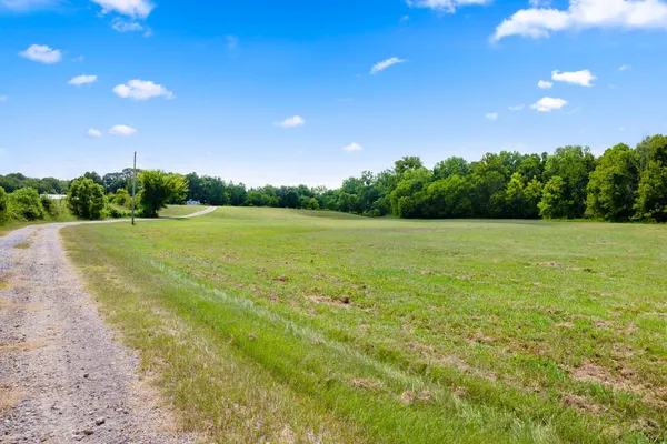 a view of a field with an outdoor space