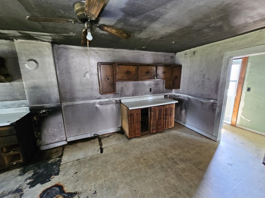 118 Tyler Street Springfield, MA 01109 - Photo 8 of 15 a kitchen with stainless steel appliances granite countertop a sink stove and cabinets