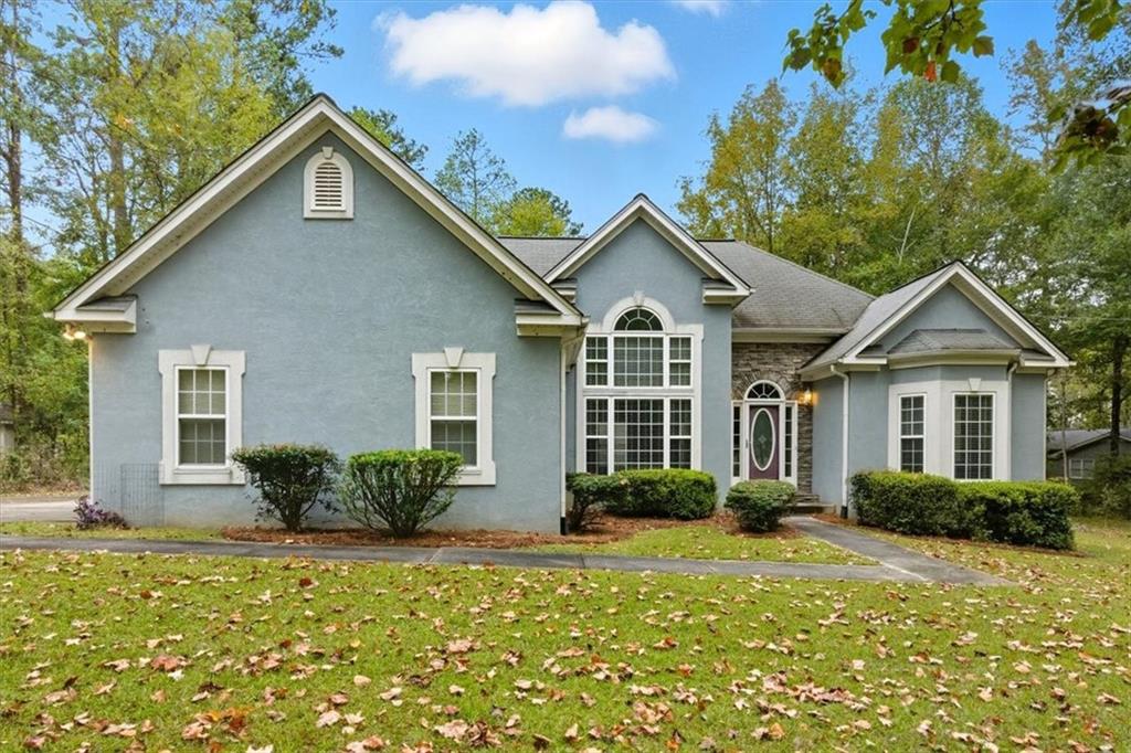 a front view of a house with a yard