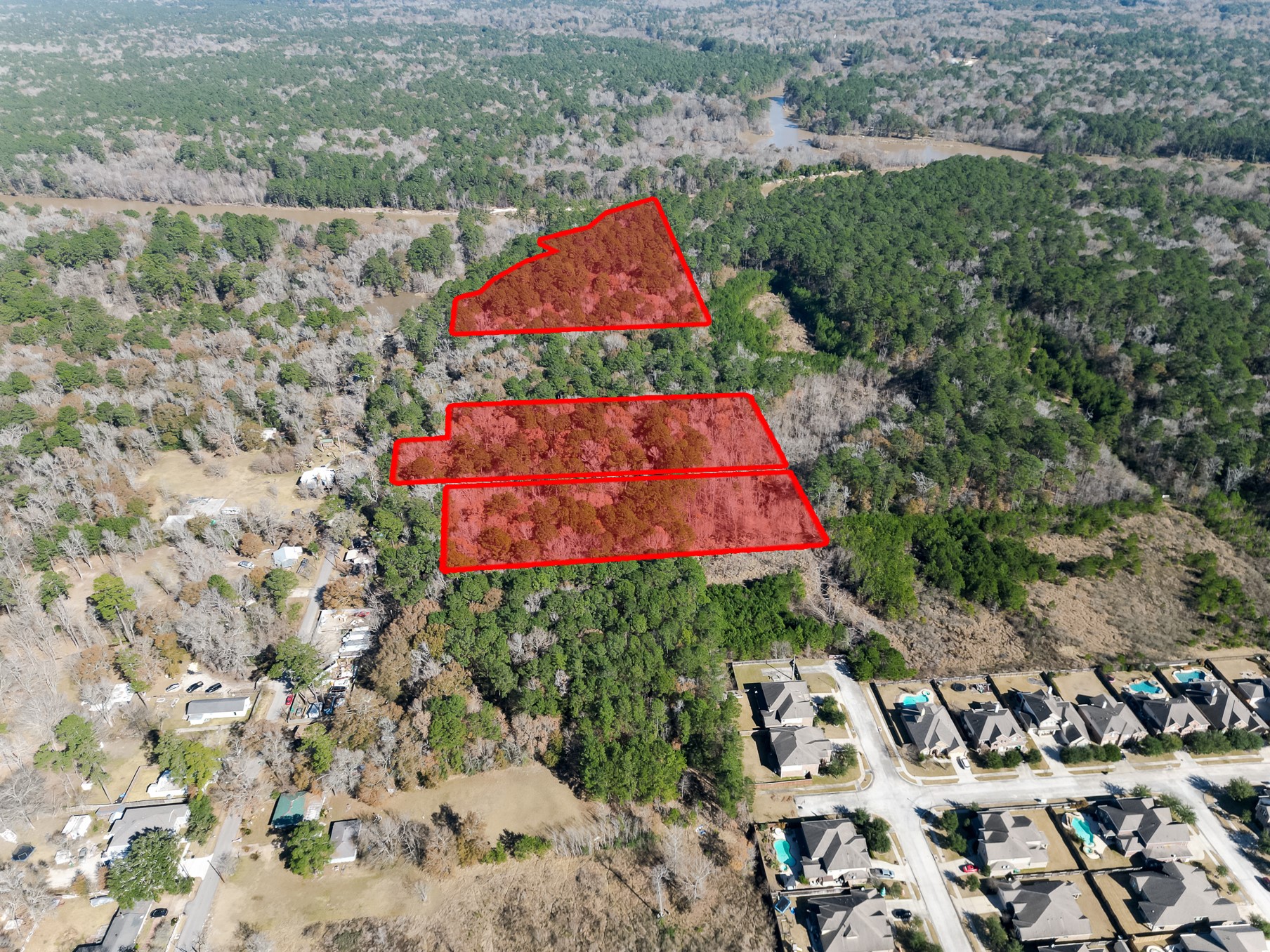 9 Dunnam Road Kingwood, TX 77345 - Photo 18 of 42 an aerial view of residential houses with outdoor space