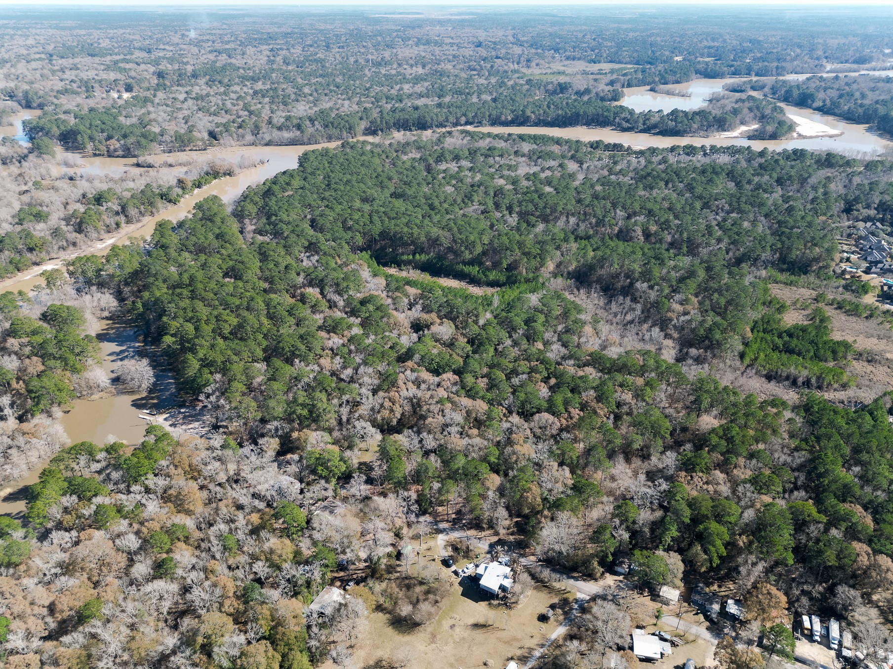 9 Dunnam Road Kingwood, TX 77345 - Photo 30 of 42 an aerial view of residential houses with outdoor space and trees