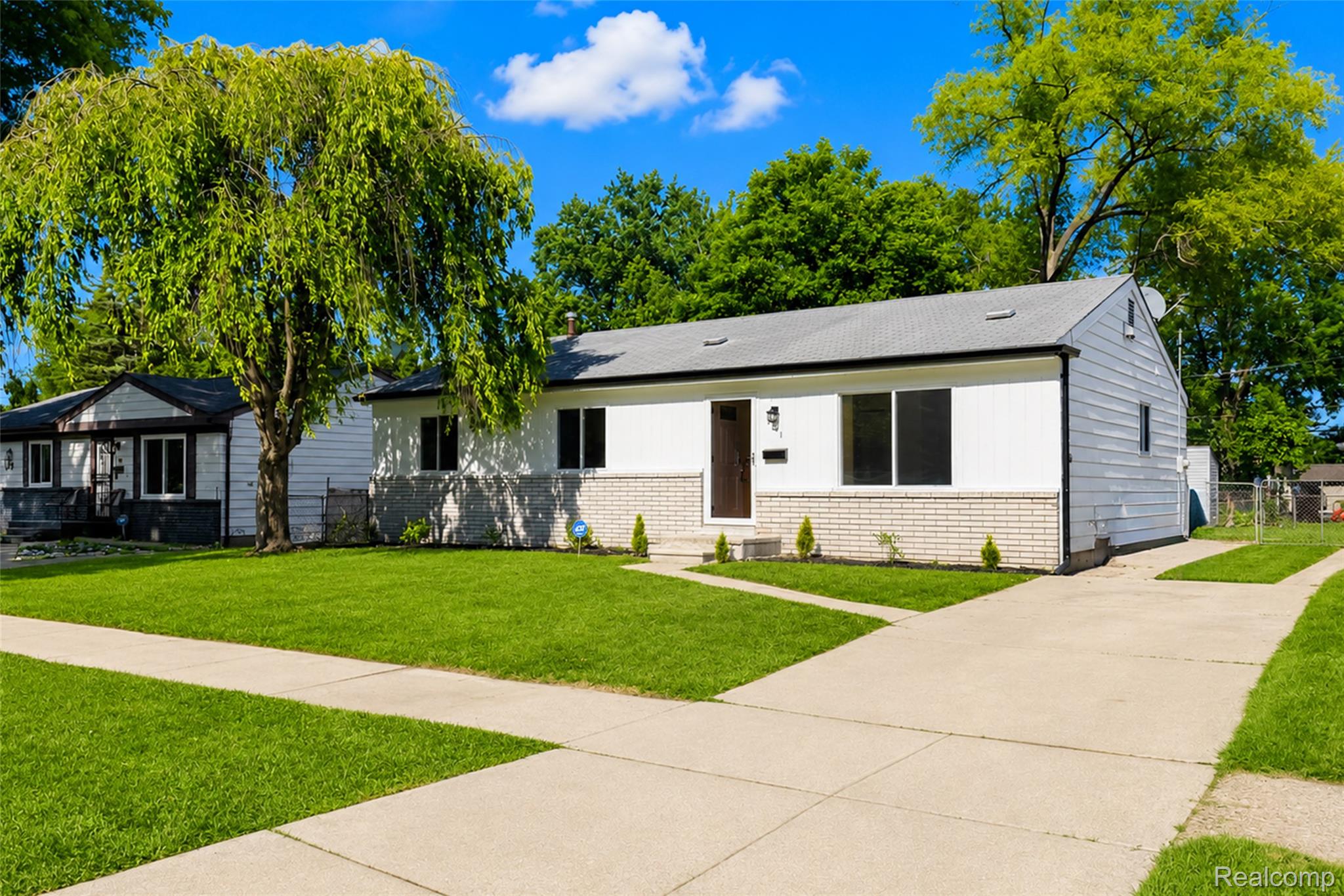 201 Cardwell Street Inkster, MI 48141 - Photo 3 of 41 Ranch-style exterior featuring white siding and a light brick facade