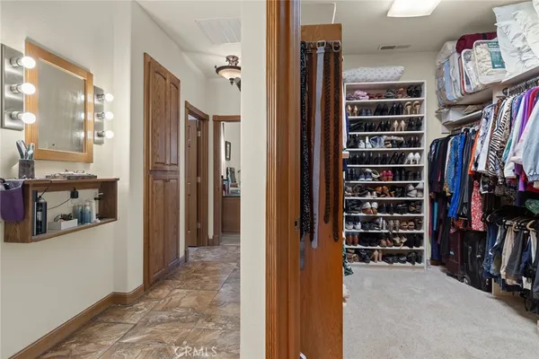 a spacious bathroom with a double vanity sink a mirror and a bathtub