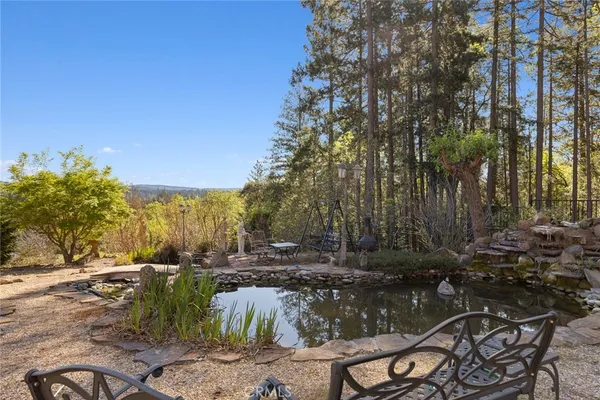 a view of a backyard with sitting area