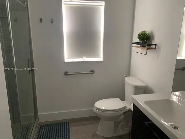 a bathroom with a toilet and a sink