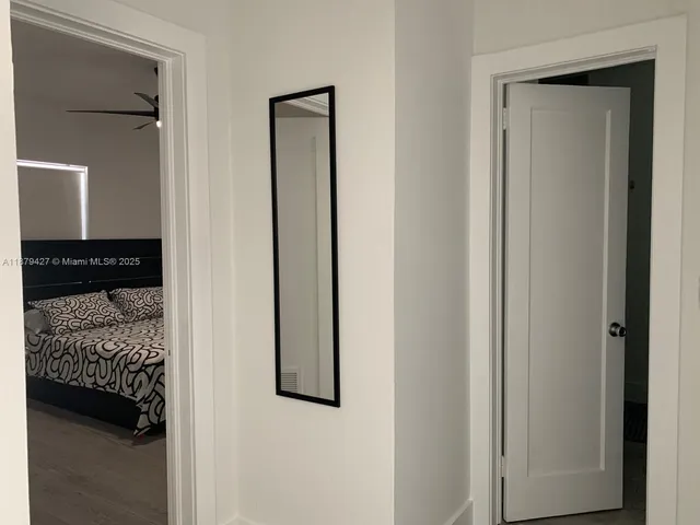a bedroom with a bed and a closet