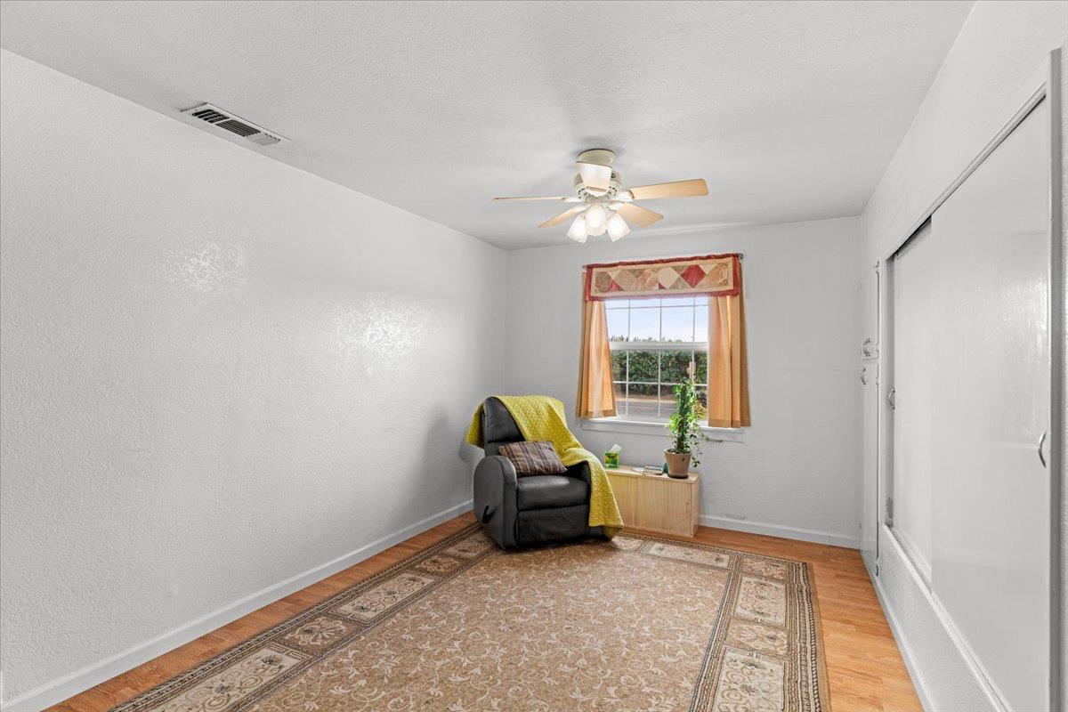 607 East Keyes Road Ceres, CA 95307 - Photo 28 of 46 sitting room with light wood-style flooring and a ceiling fan